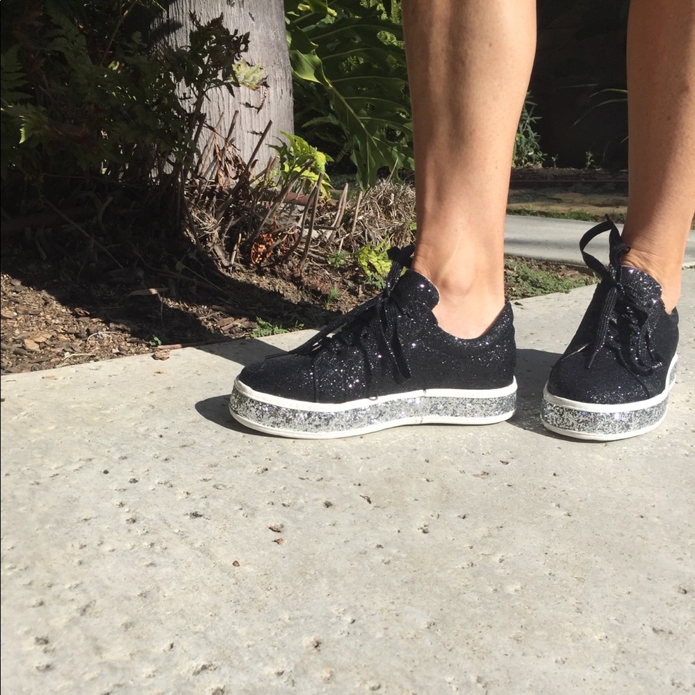 Glitter sneakers black and silver on the bottom.